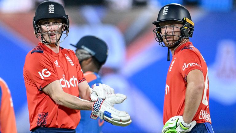 England's Jos Buttler (R) and Harry Brook