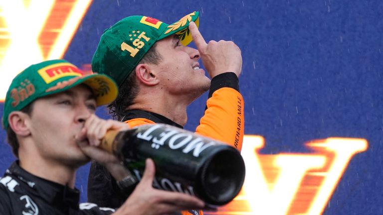 McLaren driver Lando Norris of Britain celebrates on the podium after winning the Australian Formula One Grand Prix at Albert Park, in Melbourne, Australia, Sunday, March 16, 2025. (AP Photo/Asanka Brendon Ratnayake)