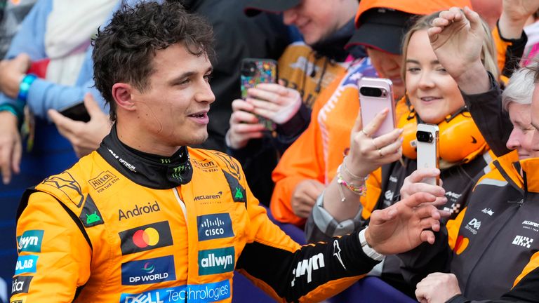 McLaren driver Lando Norris of Britain is celebrates with his team after winning the Australian Formula One Grand Prix at Albert Park, in Melbourne, Australia, Sunday, March 16, 2025. (AP Photo/Asanka Brendon Ratnayake)