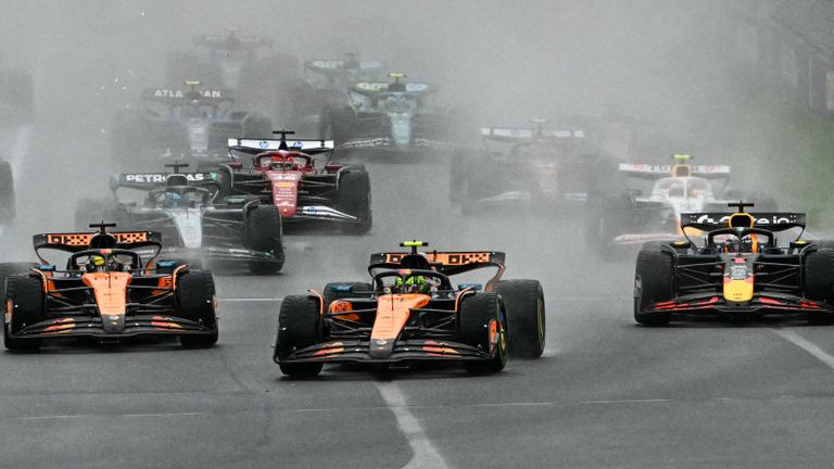 The F1 field races to the first corner at the start of the season-opening Australian Grand Prix