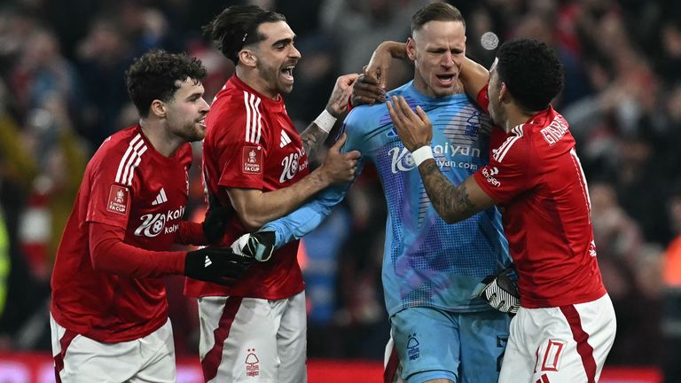 Matz Sels is congratulated by teammates after saving a penalty in the shootout