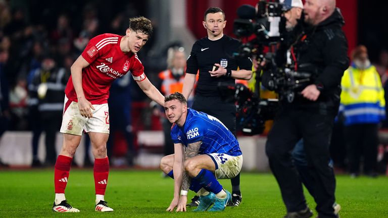 Taylor is consoled at full-time by Forest captain Ryan Yates