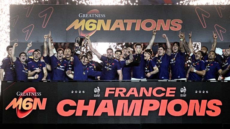 France's players celebrate with the trophy after winning the Six Nations international rugby union tournament at the end of their match against Scotland, at Stade de France in Saint-Denis, Paris' suburb, on March 15, 2025. (Photo by JULIEN DE ROSA / AFP)