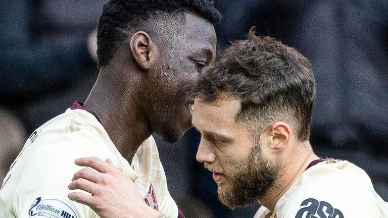 EDINBURGH, SCOTLAND - MARCH 15: Hearts' Jorge Grant celebrates with Musa Drammeh as he scores to make it 2-0 during a William Hill Premiership match between Heart of Midlothian and Ross County at Tynecastle Park, on March 15, 2025, in Edinburgh, Scotland. (Photo by Mark Scates / SNS Group)