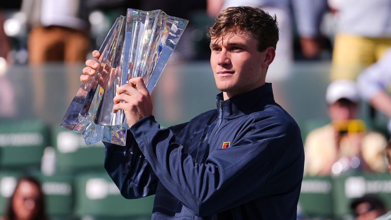 Jack Draper, of Britain, holds the winner's trophy at the BNP Paribas Open tennis tournament Sunday, March 16, 2025, in Indian Wells, Calif. (AP Photo/Mark J. Terrill)