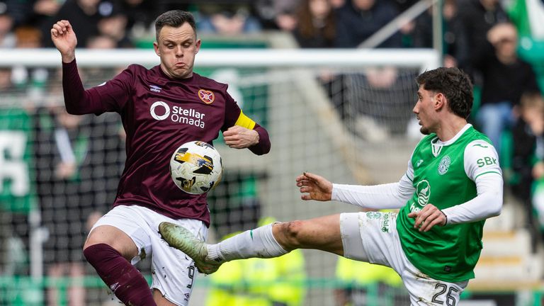 Hearts' Lawrence Shankland and Hibernian's Nectarios Triantis in action during the Edinburgh Derby