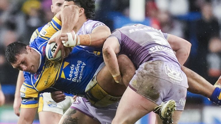 Ryan Hall is tackled in Leeds' Super League clash with Wigan