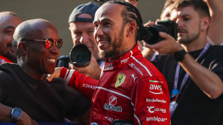 Lewis Hamilton celebrates with his father Anthony after claiming his first Ferrari pole for the Shanghai Sprint