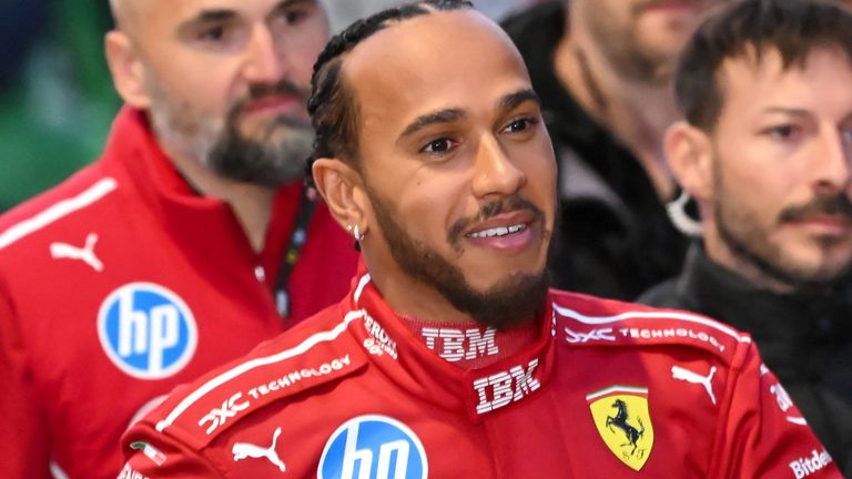 British F1 driver Lewis Hamilton signs autographs during the Scuderia Ferrari HP Drivers' presentation event by Unicredit, in Piazza Castello in Milan, on March 6, 2025. (Photo by Piero CRUCIATTI / AFP)