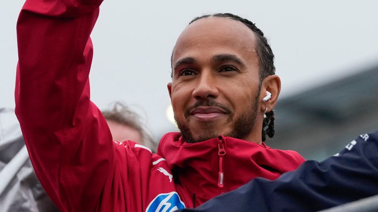 Ferrari driver Lewis Hamilton of Britain during the drivers parade ahead of the Australian Formula One Grand Prix at Albert Park, in Melbourne, Australia, Sunday, March 16, 2025. (AP Photo/Asanka Brendon Ratnayake)