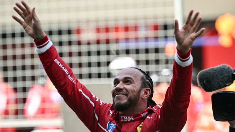 Ferrari's British driver Lewis Hamilton celebrates winning the sprint race of the Formula One Chinese Grand Prix at the Shanghai International Circuit in Shanghai on March 22, 2025. (Photo by Greg Baker / AFP)