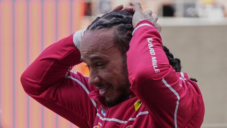 Ferrari driver Lewis Hamilton of Britain reacts after winning the sprint race ahead of the Chinese Formula One Grand Prix at the Shanghai International Circuit, Shanghai, Saturday, March 22, 2025. (AP Photo)