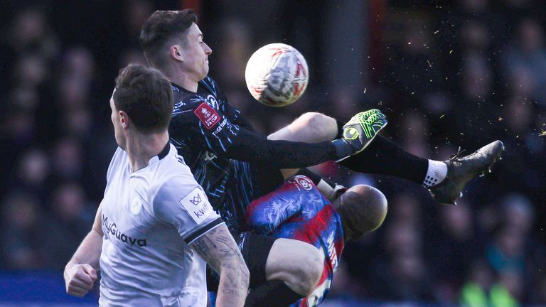 Millwall goalkeeper Liam Roberts kicks Jean-Philippe Mateta in the head with a high boot, leaving the Crystal Palace forward needing lengthly treatment