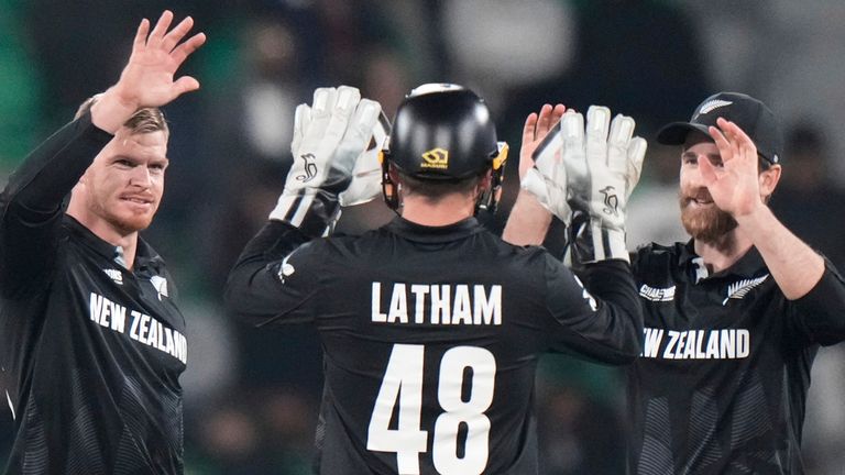 New Zealand's Glenn Phillips, left, celebrates with teammates after the dismissal of South Africa's Keshav Maharaj during the ICC Champions Trophy semifinal cricket match between New Zealand and South Africa at Gaddafi Stadium in Lahore, Pakistan, Wednesday, March 5, 2025. (AP Photo/Anjum Naveed)