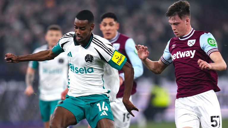 Newcastle United's Alexander Isak and West Ham United's Oliver Scarles battle for the ball