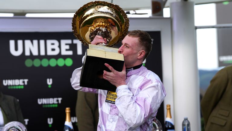 Lorcan Williams kisses the Champion Hurdle trophy