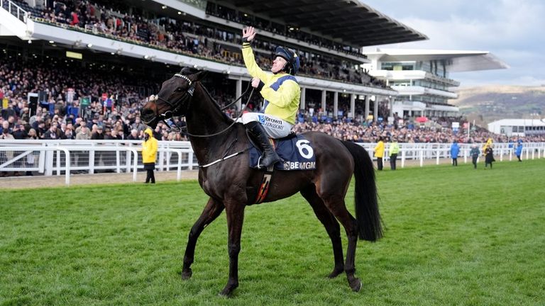 Sean Flanagan gestures to the sky after winning the Champion Chase aboard Marine Nationale