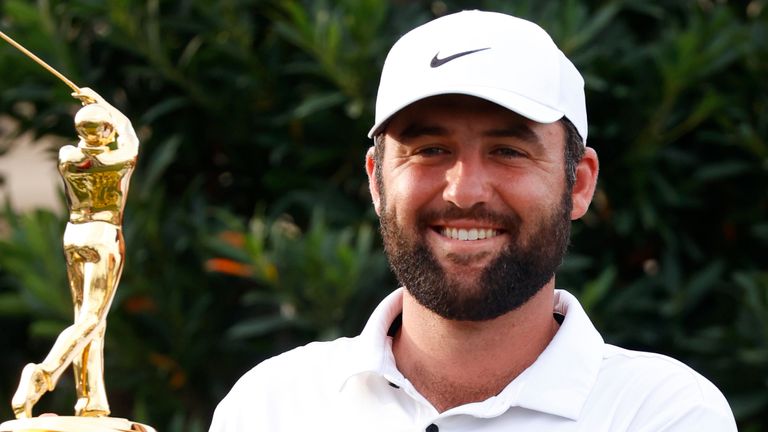 PONTE VEDRA BEACH, FL - MARCH 17: PGA golfer Scottie Scheffler poses with the trophy after winning The Players Championship on March 17, 2024, at TPC Sawgrass in Ponte Vedra Beach, Florida. (Photo by Brian Spurlock/Icon Sportswire) (Icon Sportswire via AP Images)