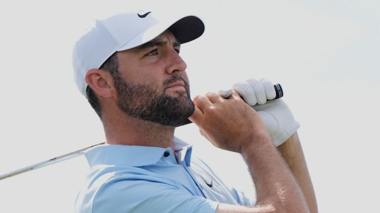 Scottie Scheffler watches his tee shot on the third hole during the second round of The Players Championship golf tournament Friday, March 14, 2025, in Ponte Vedra Beach, Fla. (AP Photo/Julia Demaree Nikhinson) 