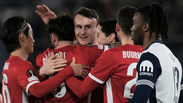 AZ Alkmaar's players celebrate after Tottenham's Lucas Bergvall scores an own goal