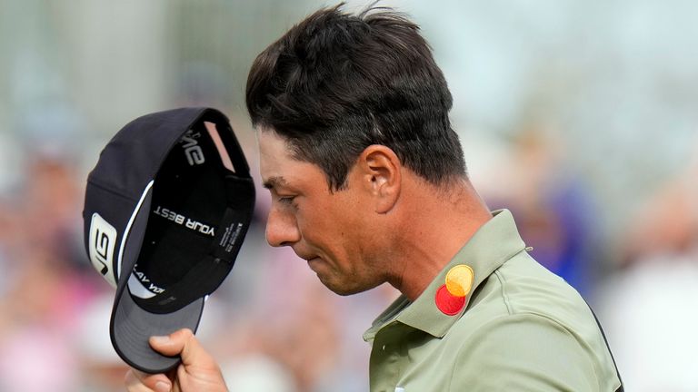 Viktor Hovland, of Norway, tips his hat after putting out on the 18th hole during the final round of the Valspar Championship golf tournament Sunday, March 23, 2025, at Innisbrook in Palm Harbor, Fla. (AP Photo/Chris O'Meara) 