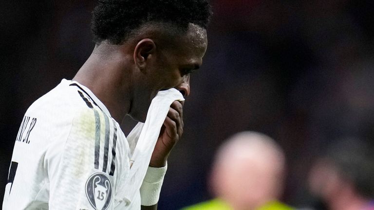 Real Madrid's Vinicius Junior reacts after failing to score a penalty during the Champions League round of 16, second leg, soccer match between Atletico Madrid and Real Madrid at the Metropolitano stadium in Madrid, Spain, Wednesday, March 12, 2025. (AP Photo/Manu Fernandez)