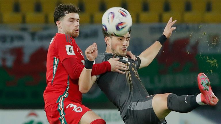 North Macedonia's Eljif Elmas, right, duels for the ball with Wales' Neco Williams during a World Cup 2026 group J qualifying soccer match between North Macedonia and Wales at National Arena Todor Proeski in Skopje, North Macedonia, Tuesday, March 25, 2025. (AP Photo/Boris Grdanoski)