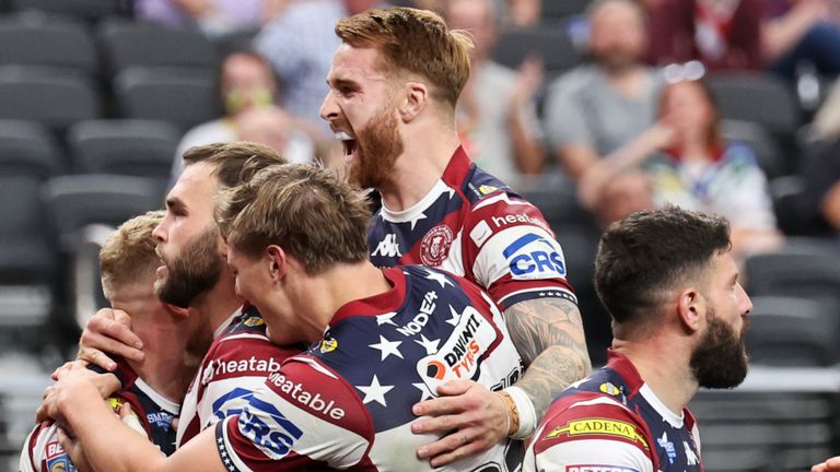 Picture by Alex Whitehead/SWpix.com - 01/03/2025 - Rugby League Las Vegas - Betfred Super League Round 3 - Wigan Warriors v Warrington Wolves - Allegiant Stadium, Las Vegas, USA - Luke Thompson of Wigan celebrating his try with teammates