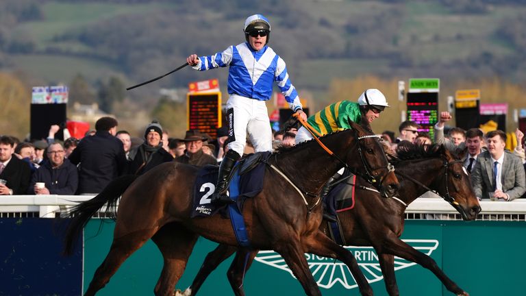 Wonderwall's jockey Rob James roars as he wins the Hunters' Chase