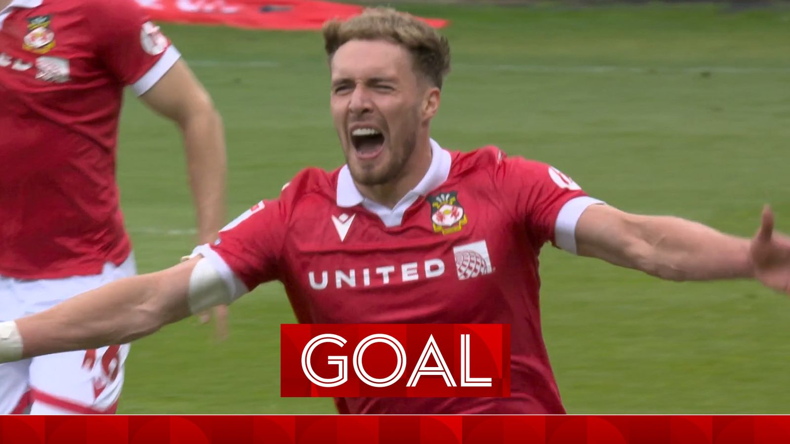Sam Smith extends Wrexham's lead over Charlton with a superb volleyed  finish.