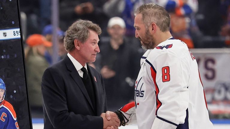 Washington Capitals forward Alex Ovechkin is greeted by Wayne Gretzky after he scored his 895th career goal