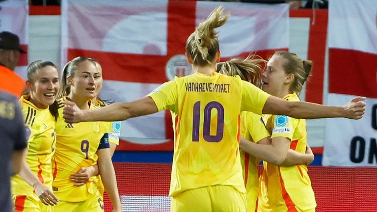 Belgium players celebrate after scoring the opening goal during the Women's Nations League soccer match between Belgium and England at Den Dreef Stadium in Leuven, Belgium, Tuesday, April 8, 2025. (AP Photo/Omar Havana)