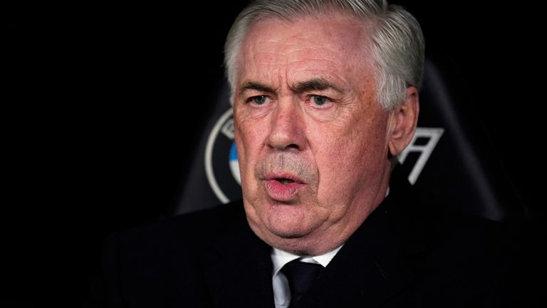 Real Madrid's head coach Carlo Ancelotti sits before a Spanish La Liga soccer match between Real Madrid and Leganes at the Santiago Bernabeu stadium in Madrid, Spain, Saturday, March 29, 2025. (AP Photo/Manu Fernandez)