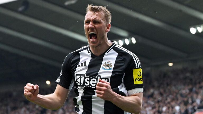 Dan Burn celebrates after heading Newcastle into a 2-0 lead against Ipswich