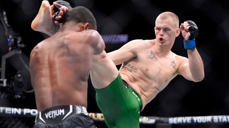 Ian Machado Garry, right, throws a kick to Geoff Neal during their welterweight bout at the UFC 298 mixed martial arts event Saturday, Feb. 17, 2024, in Anaheim, Calif. (AP Photo/Mark J. Terrill)