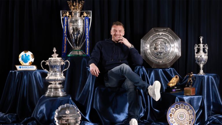 Jamie Vardy poses with numerous trophys he won during his time at Leicester