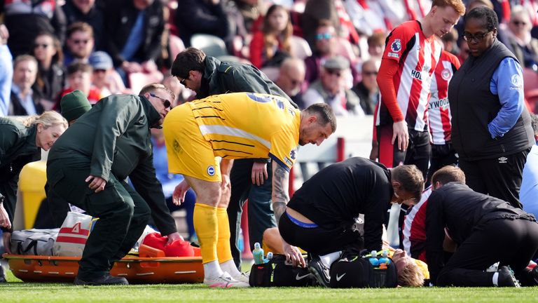 Brighton and Hove Albion's Jan Paul van Hecke receives treatment during the Premier League match at the Gtech Community Stadium, London. Picture date: Saturday April 19, 2025.
