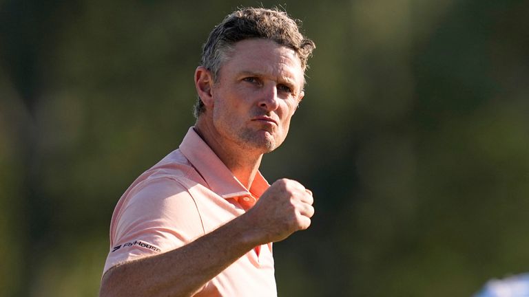 Justin Rose celebrates after his birdie on the 18th hole