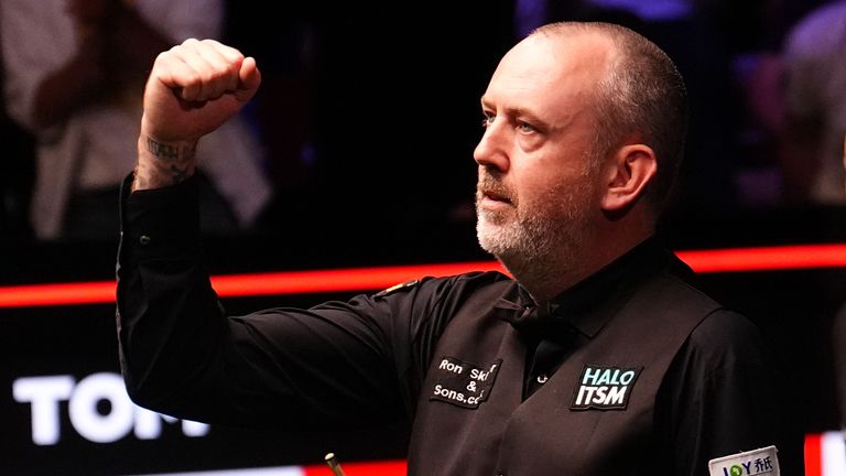 Mark Williams punches the air in celebration after winning the final-frame decider in his epic World Championship quarter-final against John Higgins