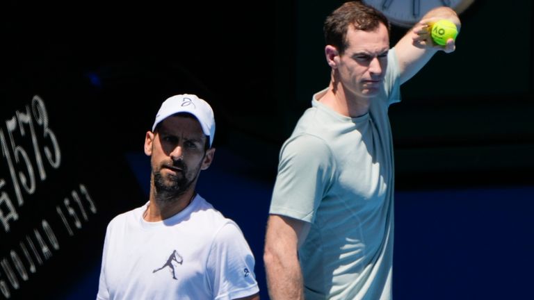 Serbia's Novak Djokovic, left, with his coach Andy Murray during a practice session ahead of the Australian Open tennis championship in Melbourne, Australia, Saturday, Jan. 11, 2025. (AP Photo/Ng Han Guan)