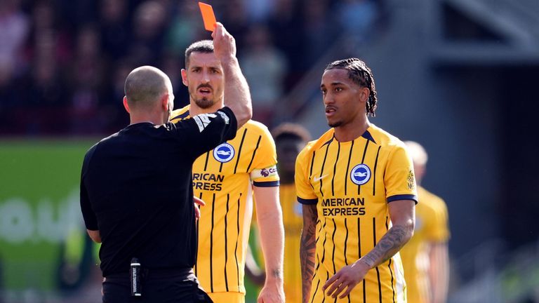 Joao Pedro is shown a red card by referee Tim Robinson