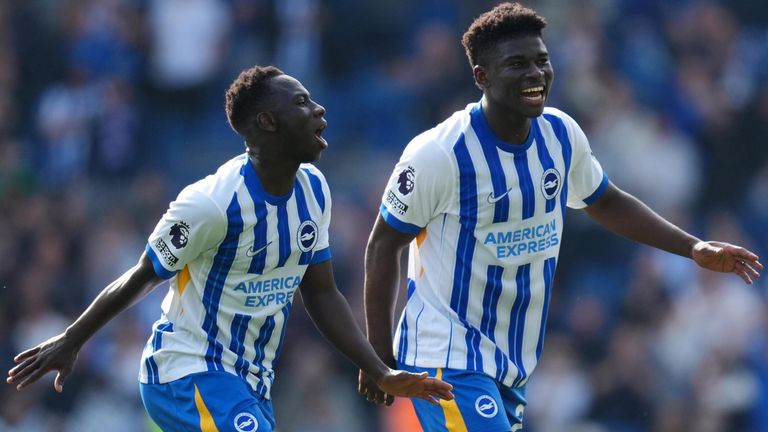 Carlos Baleba celebrates with team-mate Yankuba Minteh after scoring a late winner for Brighton against West Ham