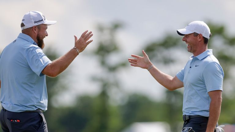 Masters champion Rory McIlroy, right, and partner Shane Lowry celebrate after McIlroy knocked in an eagle putt on the 18th hole during the Zurich Classic at TPC Louisiana in Avondale, Saturday, April 26, 2025. (Scott Threlkeld/The New Orleans Advocate via AP)