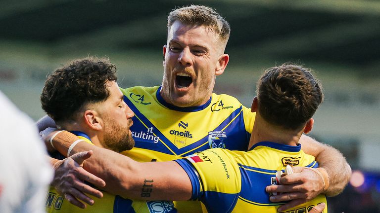 Picture by Alex Whitehead/SWpix.com - 24/04/2025 - Rugby League - Betfred Super League: Round 9 - Warrington Wolves vs St Helens - Halliwell Jones Stadium, Warrington, England - Toby King of Warrington celebrates with Lachlan Fitzgibbon and Matty Ashton after scoring a try.