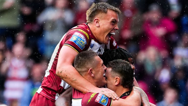 Picture by Olly Hassell/SWpix.com - 18/04/2025 - Rugby League - Betfred Super League Round 8 - Wigan Warriors v St Helens - The Brick Community Stadium, Wigan, England - Jai Field of Wigan celebrating his try with teammates