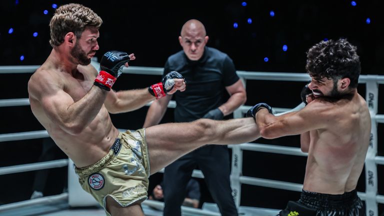 Liam Nolan looks to fend off Abolfazl Alipourandi with his kicks