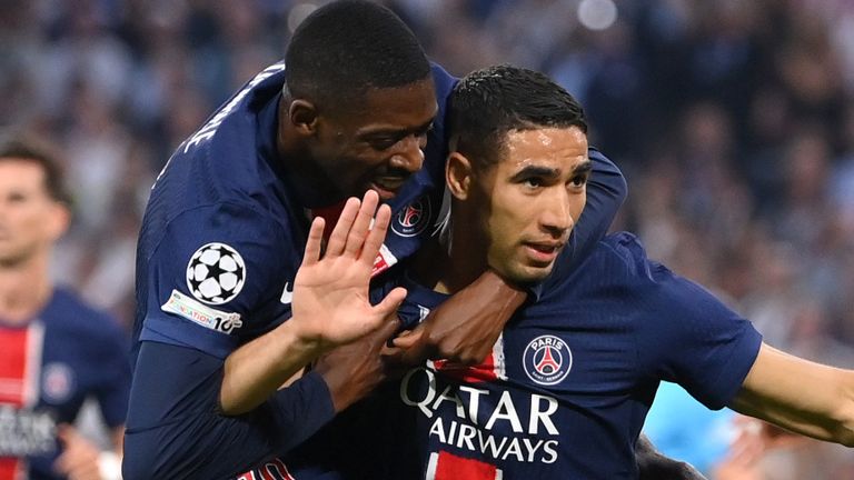 MUNICH, GERMANY - MAY 31: Achraf Hakimi of Paris Saint-Germain celebrates scoring his team's first goal with teammate Ousmane Dembele during