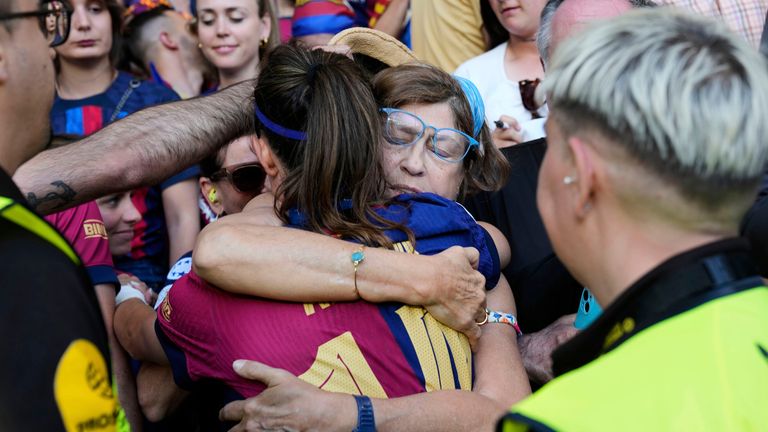 Barcelona's Aitana Bonmati, left, hugs her mother Rosa after Arsenal won the women's Champions League final soccer match between Arsenal and FC Barcelona at the Jose Alvalade stadium in Lisbon, Saturday, May 24, 2025. (AP Photo/Armando Franca)