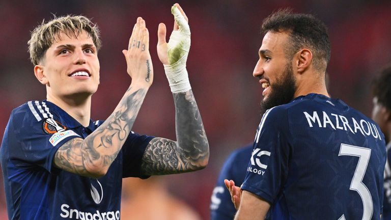 Alejandro Garnacho (left) applauds the Man Utd fans with Noussair Mazraoui at full-time