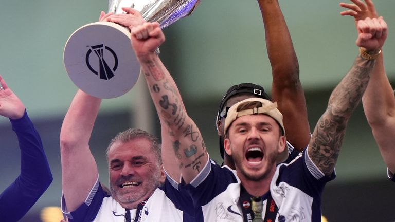 Tottenham Hotspur manager Ange Postecoglou with the trophy on stage during the Europa League winners parade in North London. Tottenham won the Europa League final after beating Manchester United 1-0 in Bilbao on Wednesday. Picture date: Friday May 23, 2025.